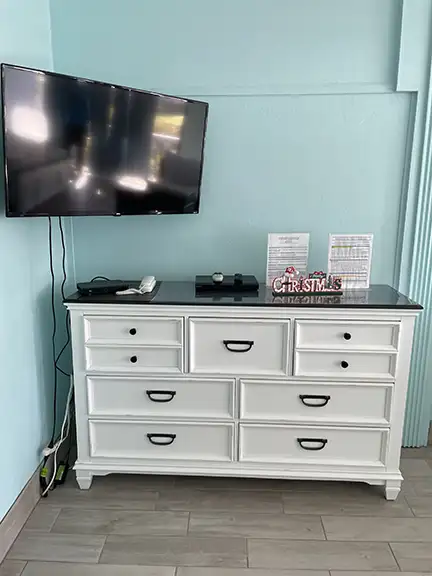 TV and dresser inside cedar key vacation rental